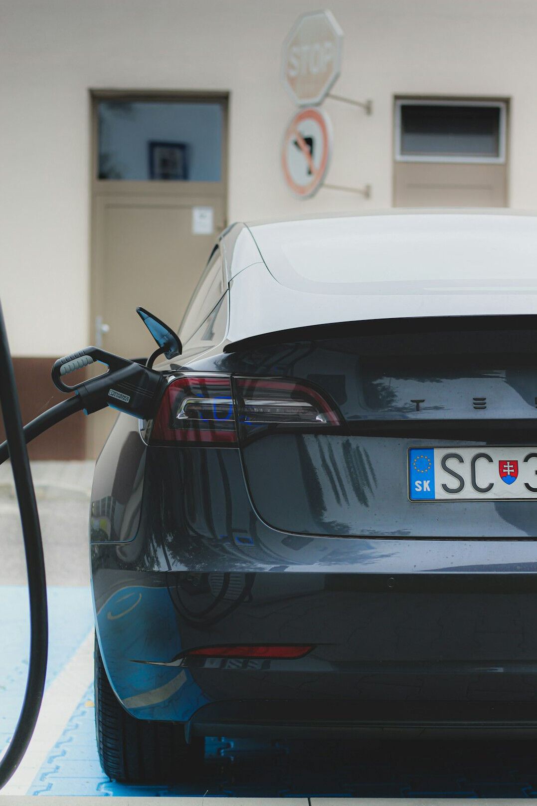 Electric car plugged into a charging station